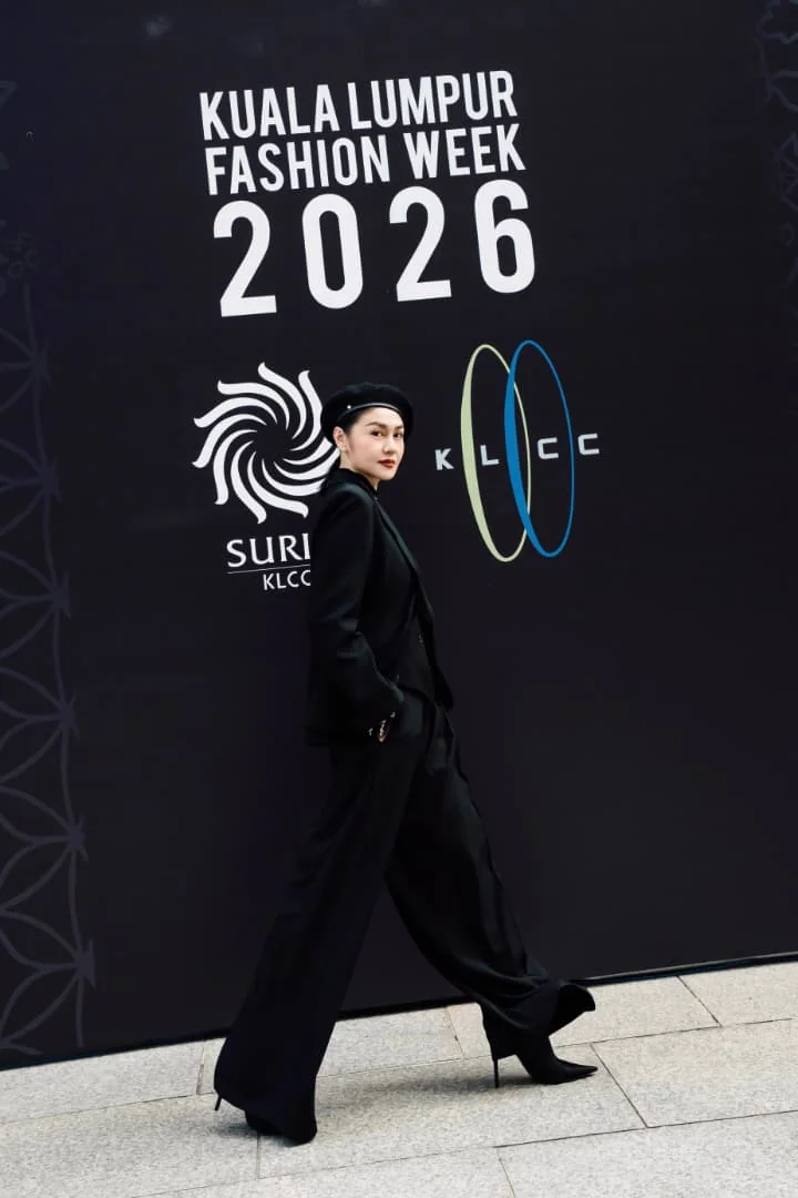 Walking past the Kuala Lumpur Fashion Week 2026 wall at KLCC